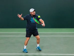 Image of a Playtester Hitting a Backhand Volley