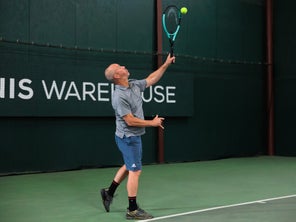 Image of a Playtester Hitting a Serve