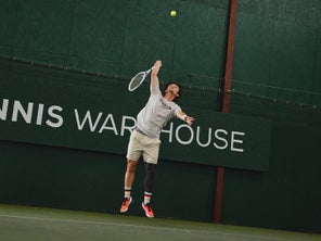 Image of a Playtester Hitting a Serve