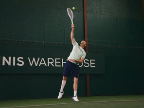 Image of a Playtester Hitting a Serve