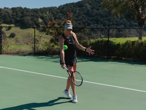 Image of a Playtester Hitting a Backhand Slice