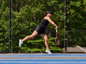 Image of a Playtester Hitting a Serve