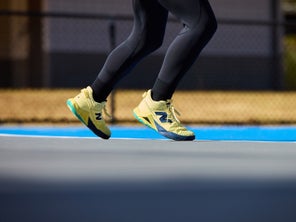 Close Up Image of Legs and Tennis Shoes 