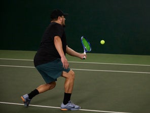 Image of a TW playtester hitting a volley. 