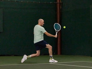Image of a TW playtester hitting a backhand. 