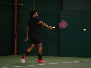 Image of a TW playtester hitting a backhand. 