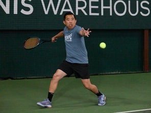 Image of a TW playtester hitting a forehand. 