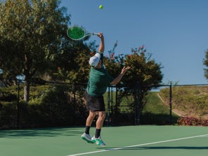 Image of a Playtester Hitting a Serve