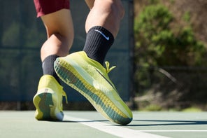Image of a Closeup Pair of Tennis Shoes Worn on Court