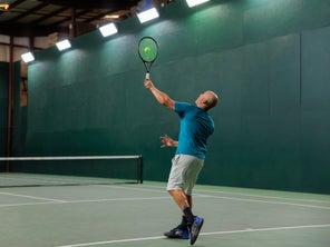 Image of a Playtester Hitting a Serve