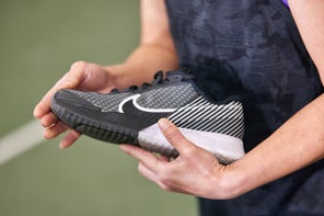 Playtester holding Tennis shoe