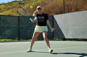 Image of a TW playtester hitting a volley. 