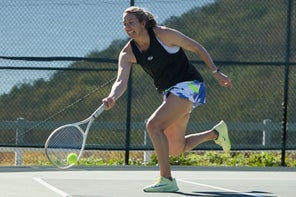Image of a TW playtester reaching for a forehand. 