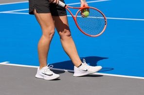 Image of a TW playtester prepping a serve. 