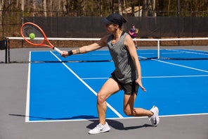 Image of a TW playtester hitting a backhand. 