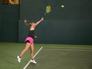 Image of a Playtester Hitting a Serve