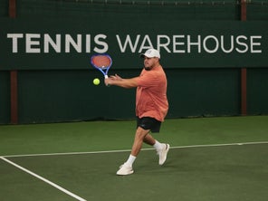 Image of a TW playtester hitting a backhand. 