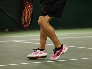 Image of a TW playtester hitting a volley. 