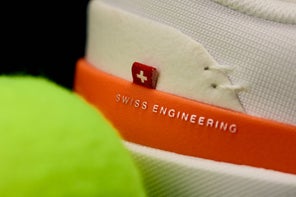 Image of the Heel of a Tennis Shoe and a Tennis Ball