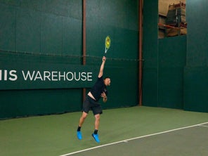 Image of a Playtester Hitting a Serve
