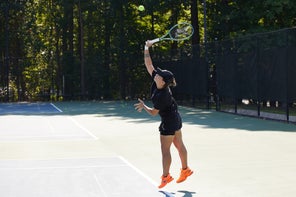 Image of Playtester Hitting a Serve