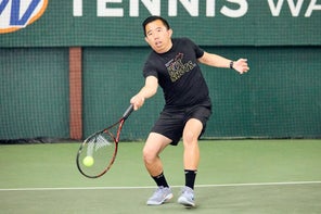 Image of a TW playtester hitting a forehand. 