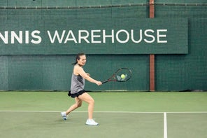 Image of a TW playtester hitting a return. 