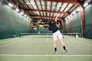 Image of a Playtester Hitting a Serve