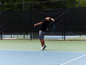 Image of Playtester hitting a serve