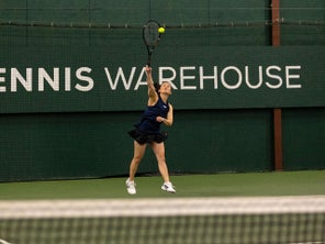 TW playtester hitting a serve. 