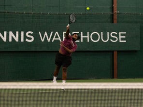 Image of a Playtester Hitting a Serve