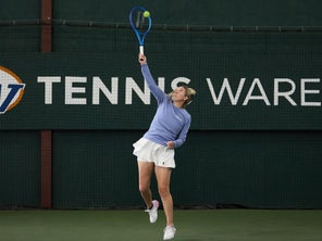 Image of a Playtester Hitting a Serve
