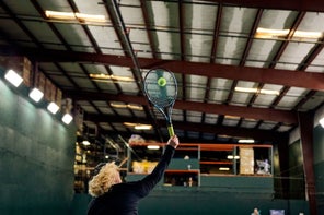 Image of a Playtester Hitting a Serve