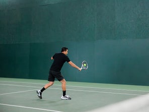 Image of a Playtester Hitting a Backhand Volley