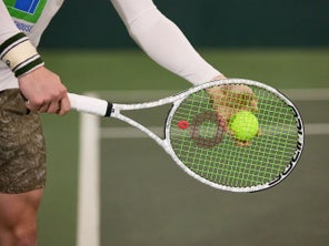 Image of a TW playtester preparing to serve. 