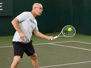 Image of a TW playtester hitting a volley. 