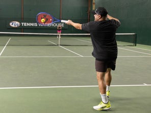 Image of a TW playtester hitting a forehand. 