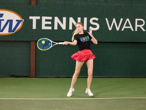 Image of a TW playtester hitting a forehand. 