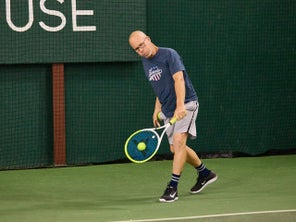 Image of a TW playtester hitting a return. 
