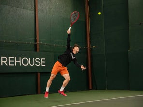 Image of a Playtester Hitting a Serve