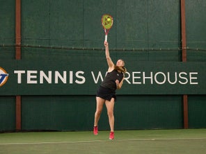 Image of a Tennis Player Hitting a Serve