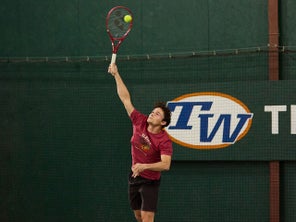 Image of a TW playtester hitting a serve. 