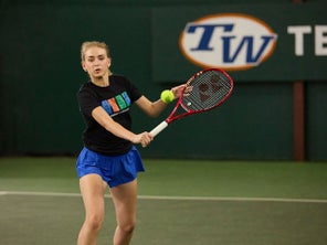 Image of a TW playtester hitting a volley.