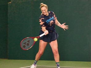 Image of a TW playtester hitting a forehand. 