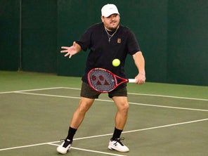 Image of a TW Playtester hitting a volley. 