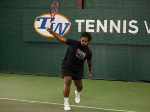 Image of a Playtester Hitting a Backhand Return