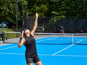 Image of a Playtester Hitting A Serve