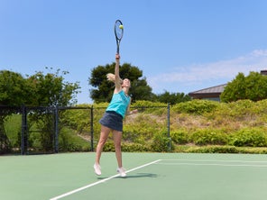 Image of Playtester Hitting a Serve