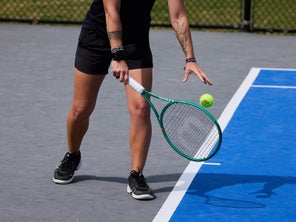 Image of a Playtester Hitting a Serve