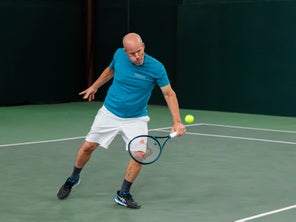 Image of a Playtester Hitting a Backhand Volley